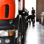automobile mechanic checking truck in the garage, selective focus